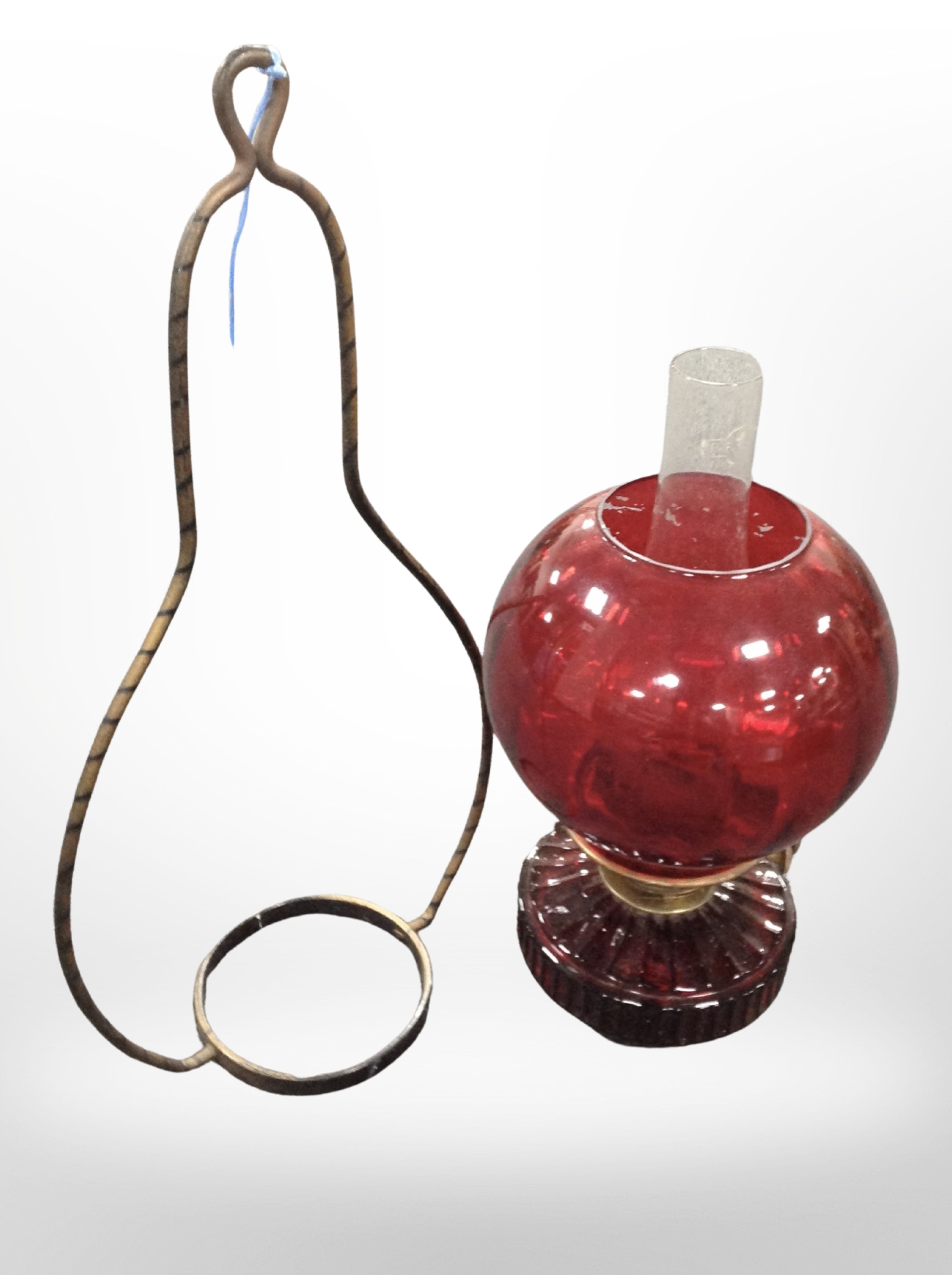A ruby glass hanging oil lamp.