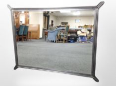 A contemporary metal framed bevelled overmantel mirror,