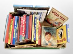A box of vintage school boy's annuals and other books.