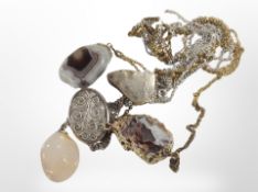 Five assorted pendants with semi-precious stones.