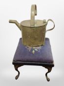 A brass watering can and a vIctorian footstool on metal legs.