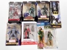A group of Hasbro and other action figures including DC and Marvel.