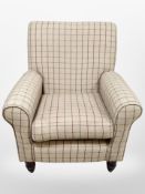 A contemporary wingback armchair