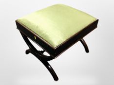 A Victorian mahogany stool in green silk upholstery,