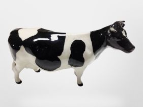 A Beswick C H Claybury Leegwater Friesian cow, height 12cm.