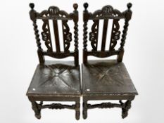 A pair of 19th century carved oak hall chairs