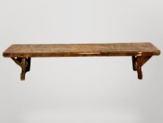 A pine and plywood low bench,