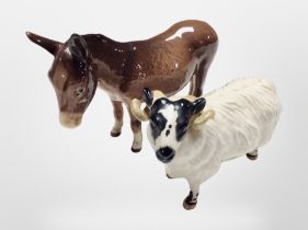 A Beswick donkey and a ram, tallest 11cm.