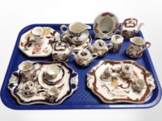 A group of Mason's china including miniature tea sets, chamber stick, picture frame, etc.