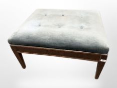 An early 20th-century mahogany-framed rectangular foot stool in blue dralon upholstery, length 80cm.