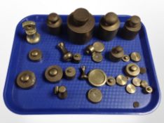 A group of antique brass graduated weights.