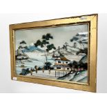 A Japanese print on glass depicting figures in a landscape, 59cm x 38cm.