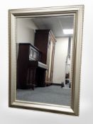 A contemporary silvered overmantel mirror,