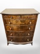 A simulated rosewood bow fronted six drawer chest,