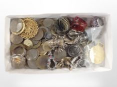 A small tray of dress rings and assorted coins.