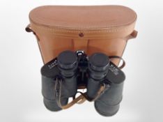 A pair of Ajax 10x50 binoculars in leather case.