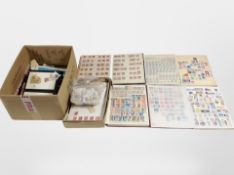A box of several stamp albums and loose stamps, first day covers, etc.