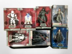 A group of Disney Star Wars action figures.