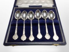 A cased set of six Lindisfarne silver teaspoons, retailed by Reids of Newcastle.