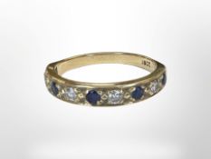 An 18ct gold diamond and sapphire half eternity ring, size O. CONDITION REPORT: 3.2g.