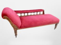 A Victorian carved beech framed chaiselongue in buttoned upholstery,