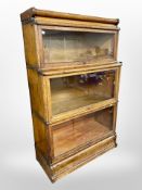 An Edwardian oak glazed stacking bookcase in the manner of Globe Wernicke,