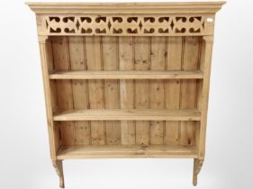 A carved pine kitchen plate rack,