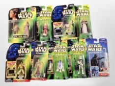 A group of Hasbro and Kenner Star Wars action figures.