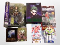 A group of boxed action figures including Lucy Westenra, Herocross figure of the Joker, Toy Story,