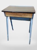 A 20th century metal framed school desk by Esavian,