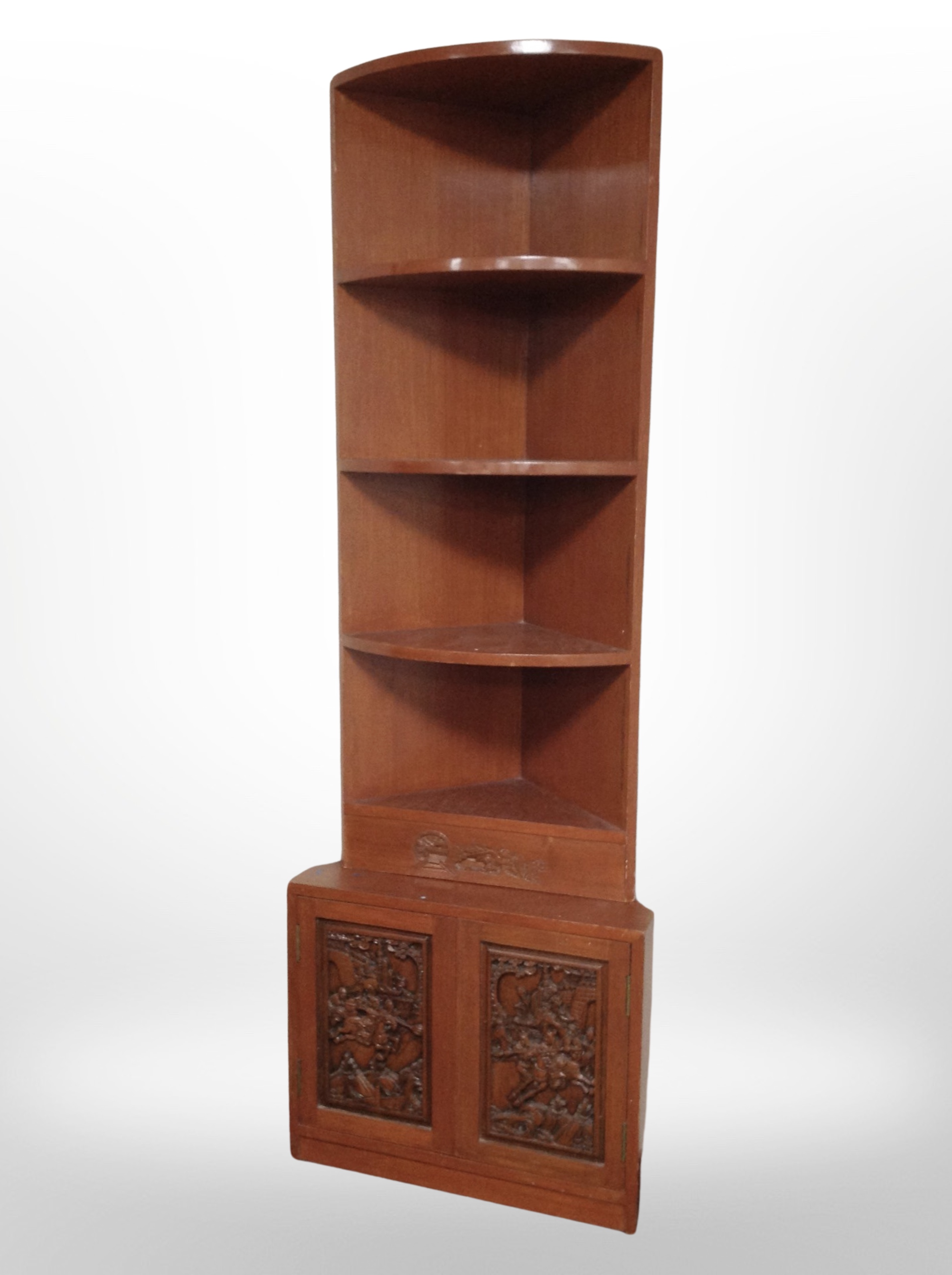An Oriental style carved corner cabinet,