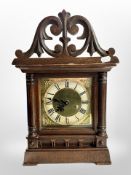 A reproduction carved bracket clock,