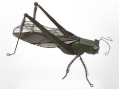 A metal figure of a grasshopper, length 40cm.