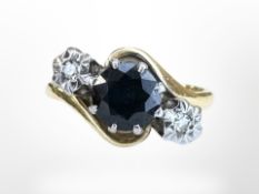 An 18ct yellow gold two stone diamond and sapphire ring, size L, 4.1g.