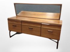 A Durable Suites Limited teak mirror back dressing table,
