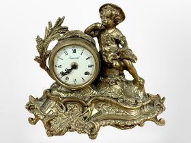 A gilt metal figural mantel clock, the dial signed Imperial, striking on a bell, with key,