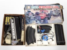 A Scalextric Formula-1 GP8 Racing Set, and a further box containing track, etc.
