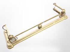 A Victorian brass fender.