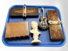A tortoiseshell and mother of pearl musical guitar, a wooden money box in the form of a book,