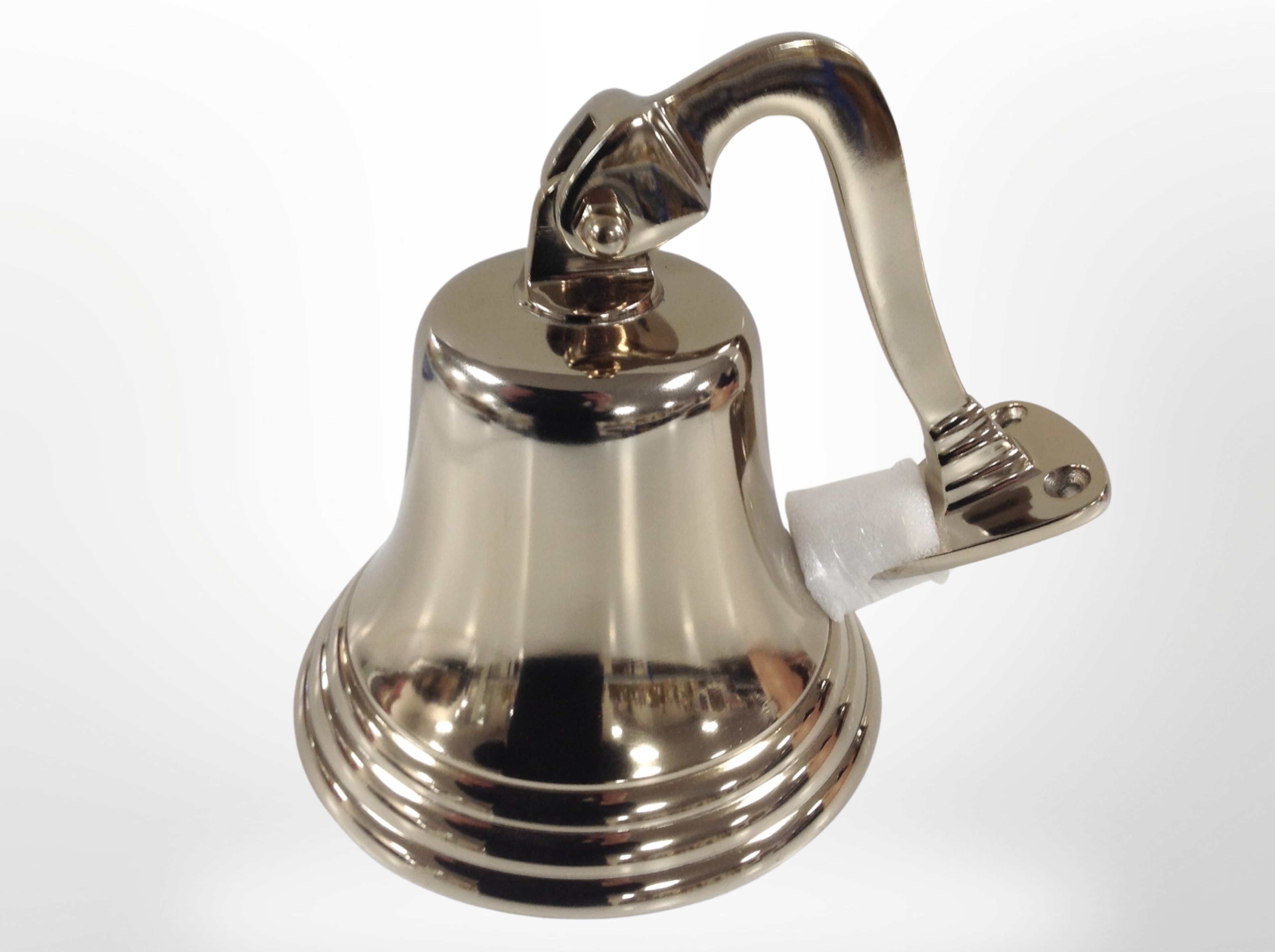 A ship's-style bell in brass finish, height 16cm.