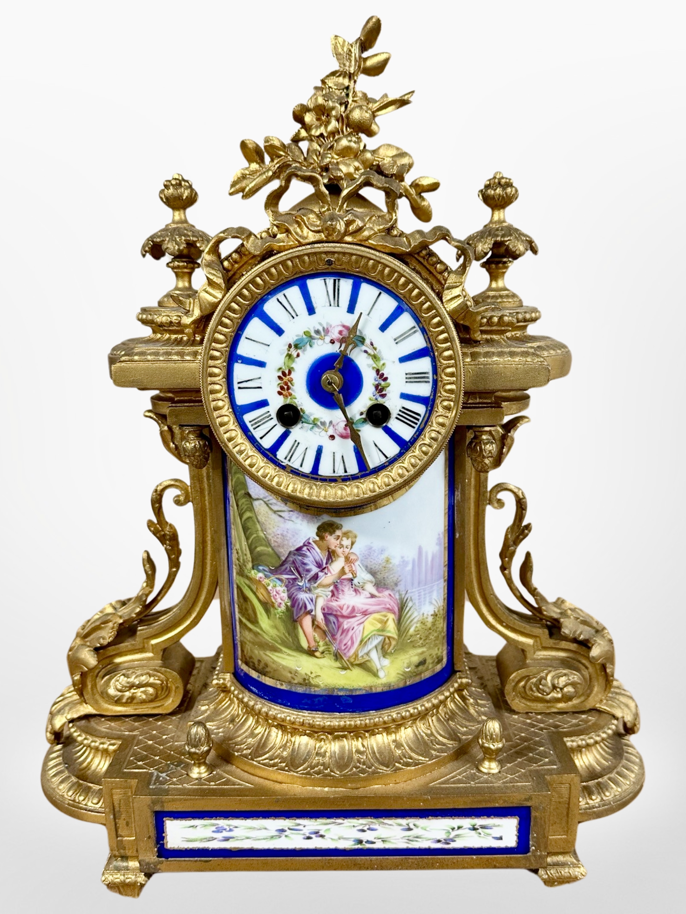 A 19th century French gilt metal and enamelled porcelain mantel clock, striking on a bell,