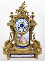 A 19th century French gilt metal and enamelled porcelain mantel clock, striking on a bell,