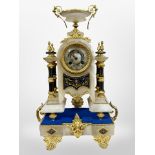 A 19th century French alabaster and gilt metal mantel clock, striking on a bell, with key,