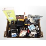 A box of vintage Kodak and Polaroid cameras, wall clock,