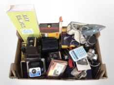 A box of vintage Kodak and Polaroid cameras, wall clock,