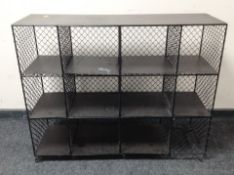 A stained pine and metal mesh door low sideboard,