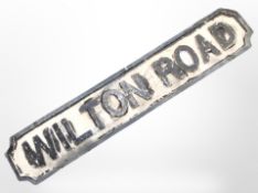 A painted cast-iron Wilton Road sign, length 98cm.