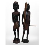 Two African carved wooden figures, tallest 61cm.