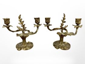 A pair of 19th century Rococo Revival gilt metal candlesticks, height 19cm.