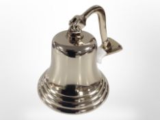 A ship's-style bell in brass finish, height 21cm.